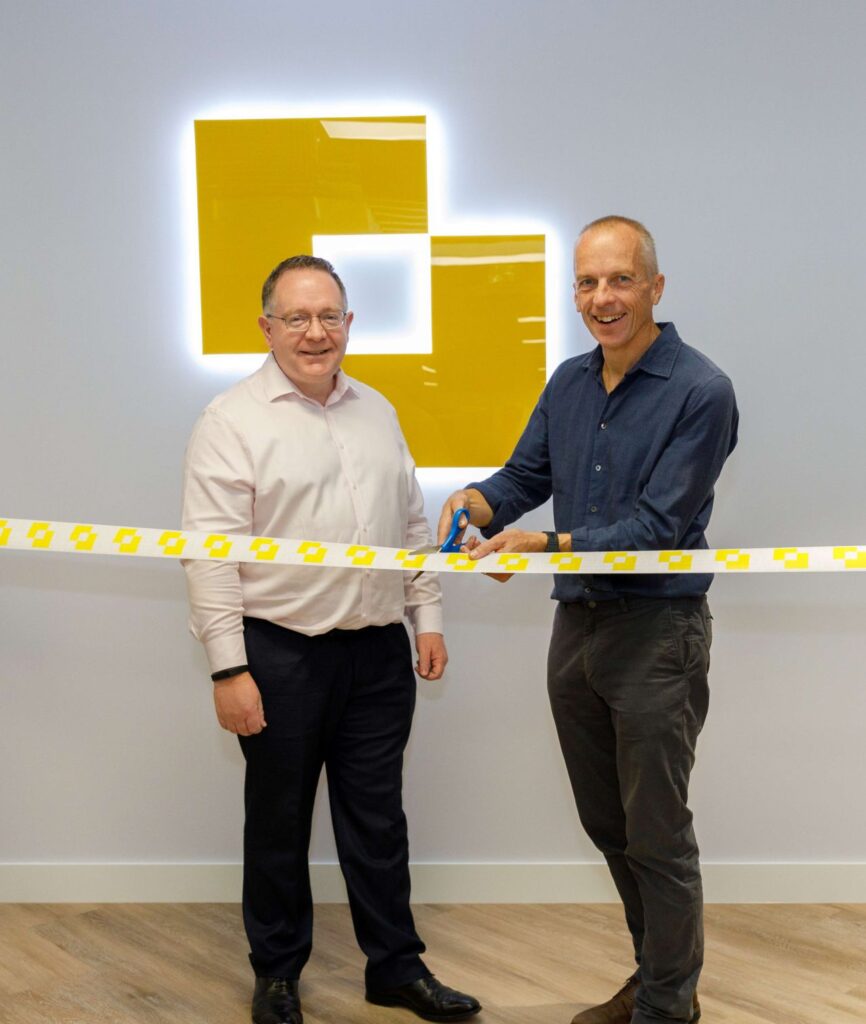 Modulr new office - Myles and Rob cutting the ribbon.